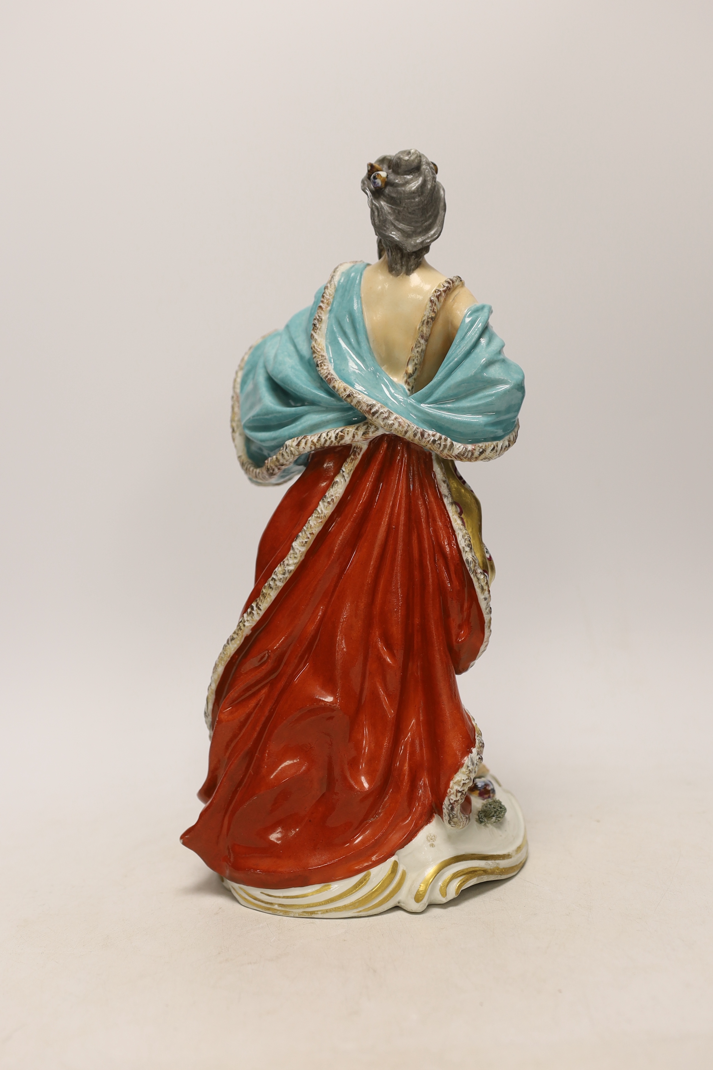 A Derby style figure of Neptune, two Wedgwood plates (one a.f.) and a Staffordshire drab ground jug, largest 32cm high